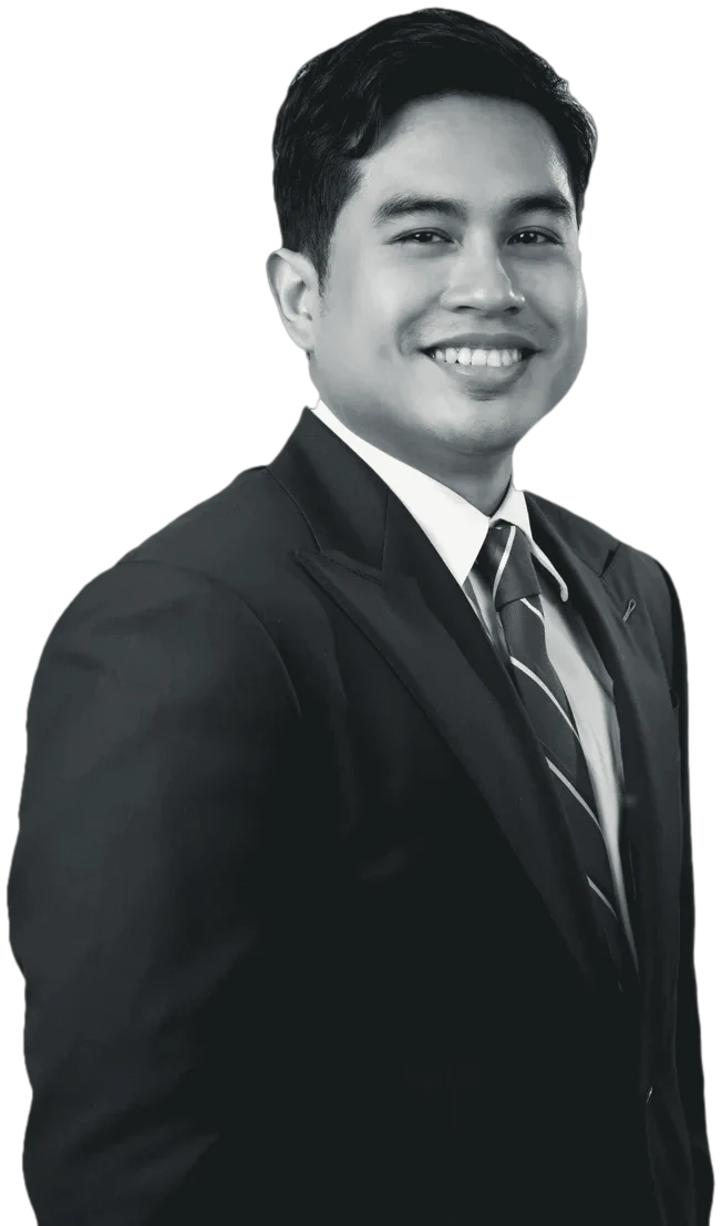 Atty. Daniel Fordan in a dark suit and striped tie, smiling